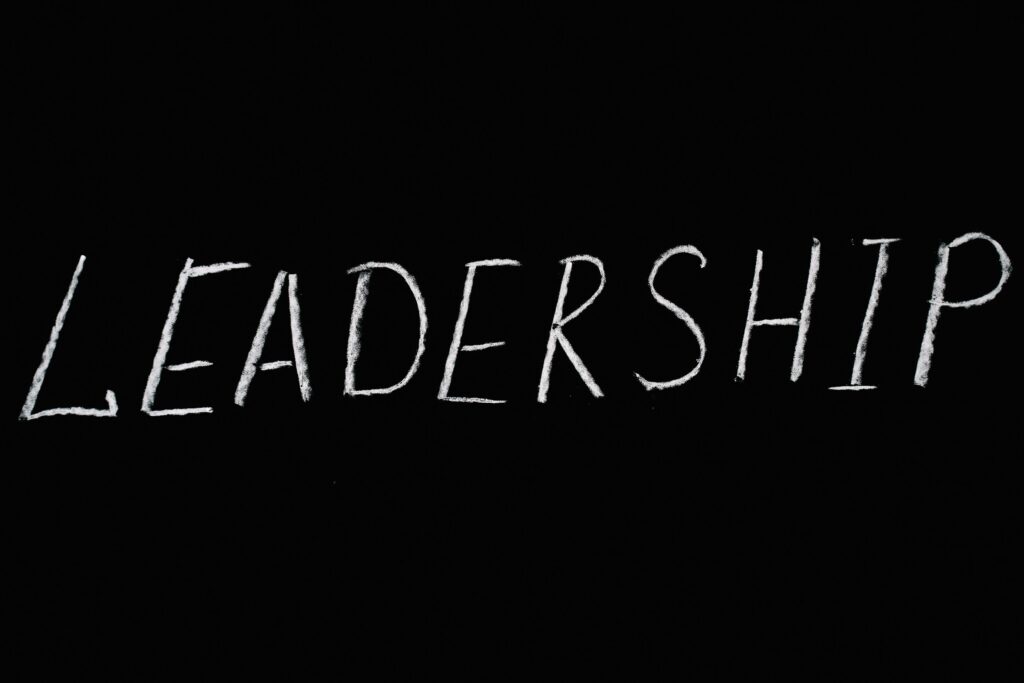 DAY 13- LEADERSHIP Chalk text spelling 'Leadership' on a blackboard, symbolizing guidance and authority.