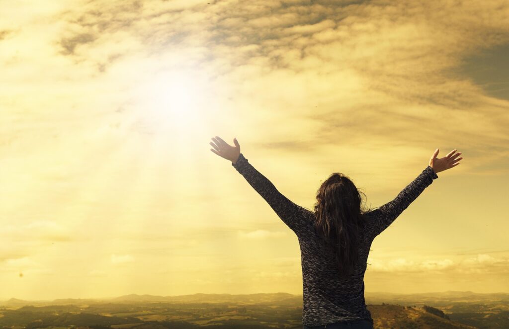 woman, sky, sunlight, nature, arms, open arms, sunbeams, sunrays, clouds, worship, freedom, happiness, relieved, prayer, praise, success, joy
