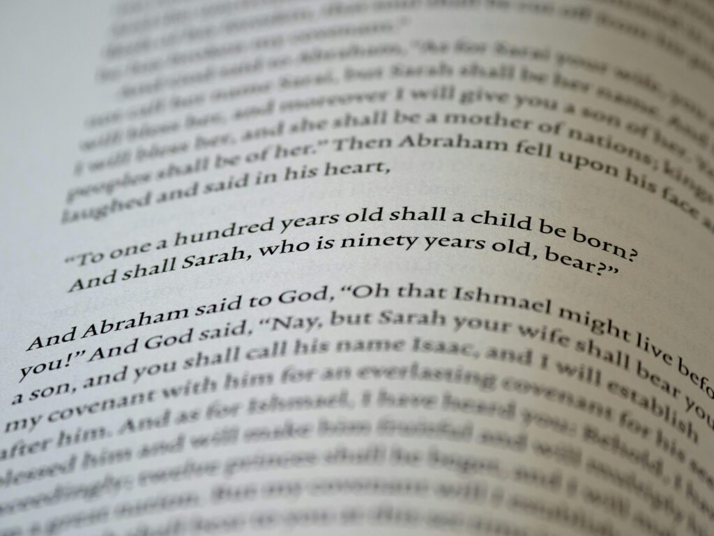 Close-up of text from the Book of Genesis in the Bible.
