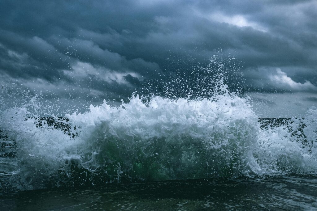 Dramatic waves crash against the shore in Odesa, capturing the power of nature under stormy skies.