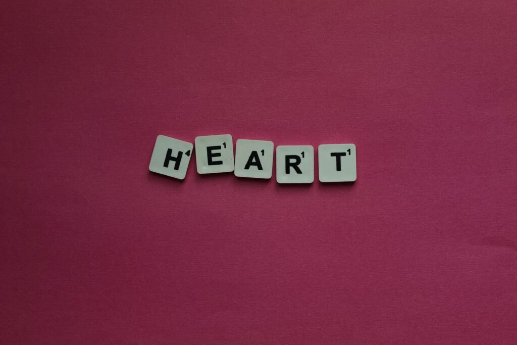 5 OCTOBER 2026, DAY 278 - A HEART THAT LONGS FOR GOD’s HEART Scrabble letter tiles spelling heart on a pink background for creative projects.