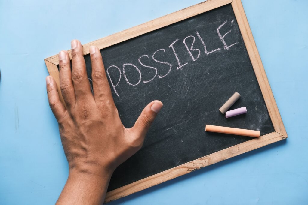 2 OCTOBER 2026, DAY 275 -NOTHING IS IMPOSSIBLE FOR GOD
A hand on a chalkboard with 'Possible' written in chalk signifies optimism and potential.